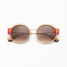 Paire de lunettes à monture dorée et verres teintés
